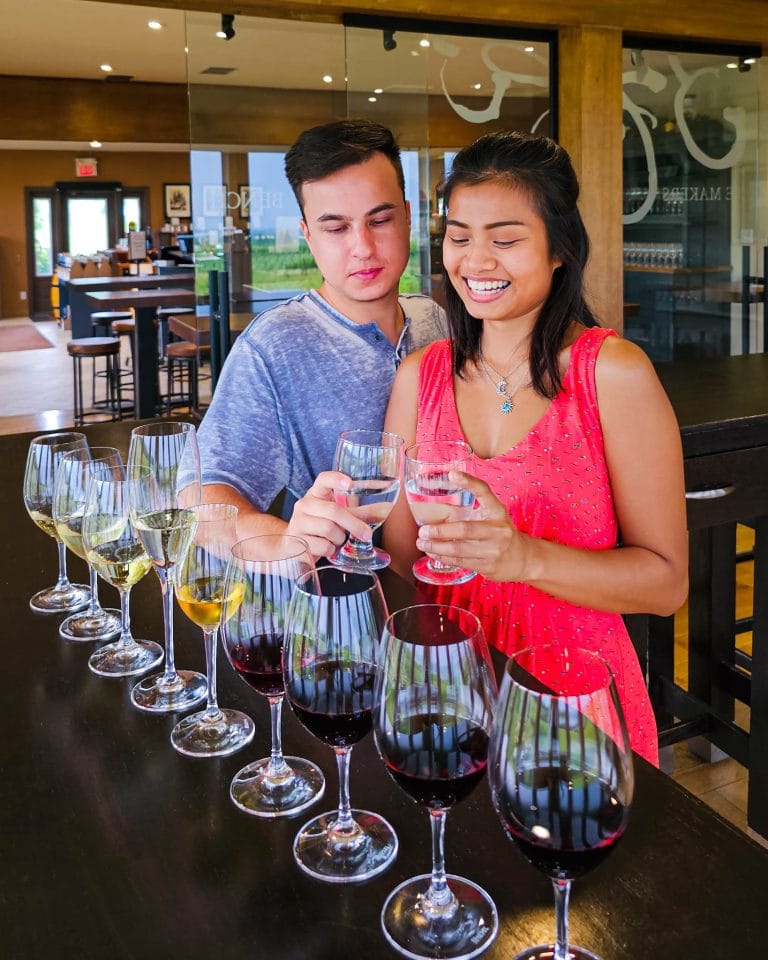 couple having wine tasting at Niagara wineries, with Visa Infinite benefits