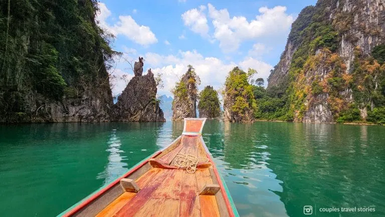 End of the boat with limestone cliffs in the back at Cheow Lan Lake, Khao Sok National Park, Thailand