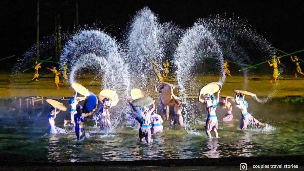 Watching a traditional show with splashes of water in Hoi An Memories Land Show, a day trip from Da Nang
