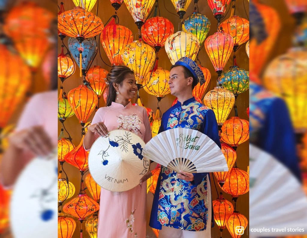 Wearing traditional Vietnamese costume with lanterns in the back at Viet Sense Cafe, Da Nang, Vietnam