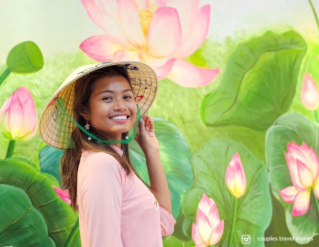 Wearing traditional Vietnamese costume with lanterns in the back at Viet Sense Cafe, Da Nang, Vietnam