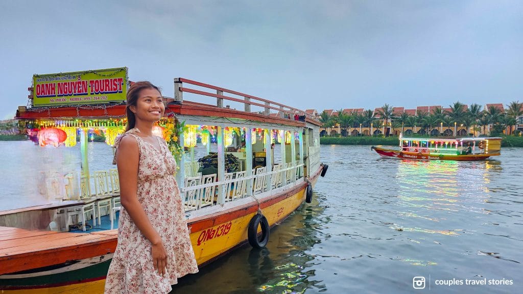 Boats with lanterns lit cruising along Thu Bon River, Hoi An, Vietnam