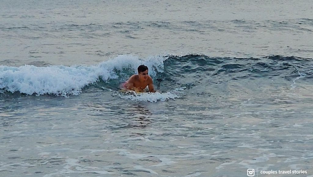 Catching waves and surfing in Senggigi, Lombok