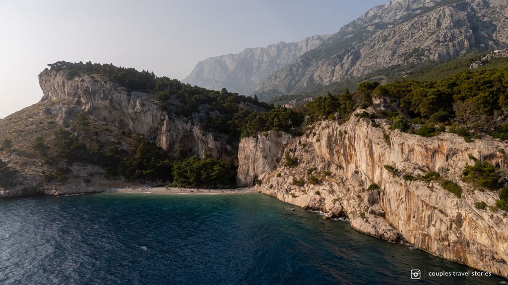 Croatia beach Makarska riviera Croatian beach drone view with large mountainous cliffs