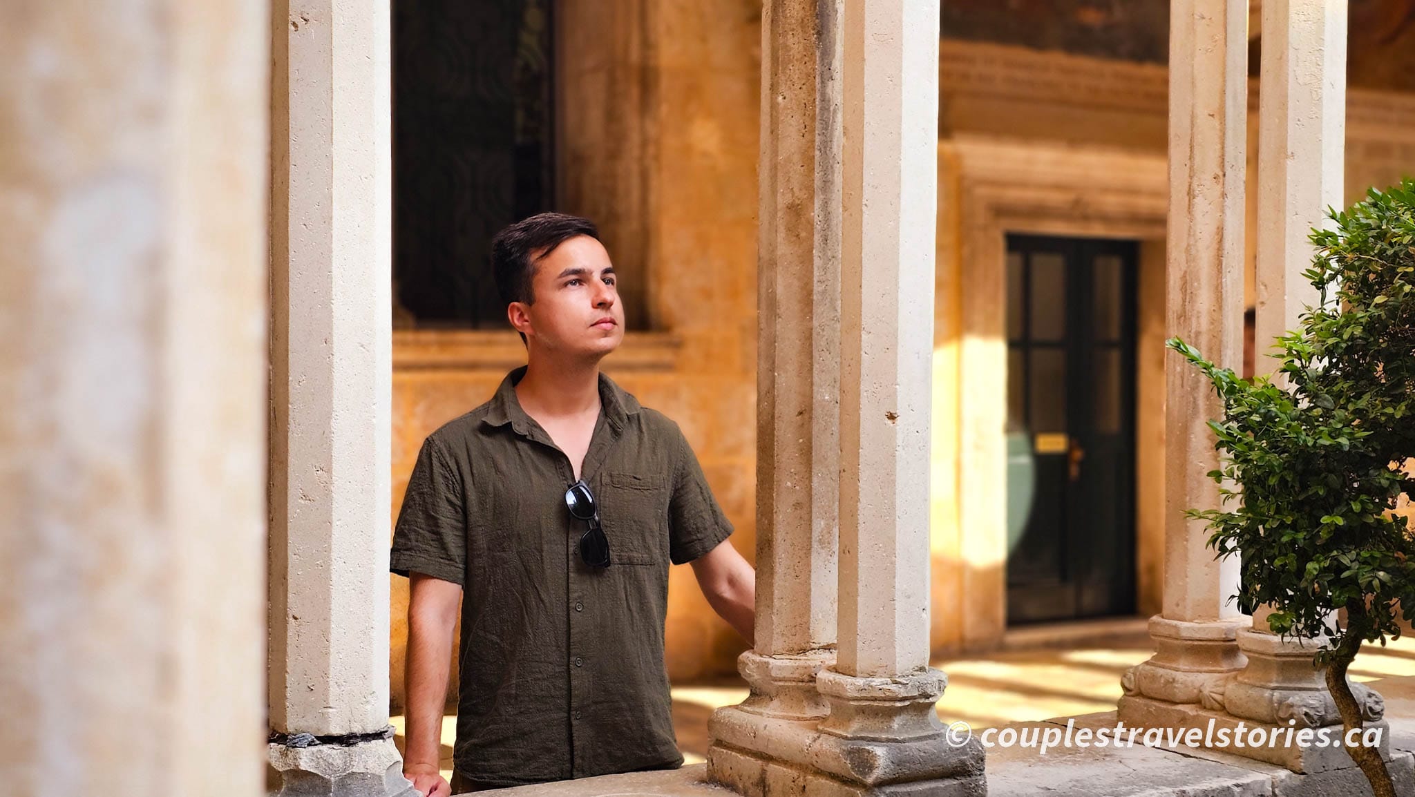 Man in the courtyard of St. Francis church in Dubrovnik Old Town