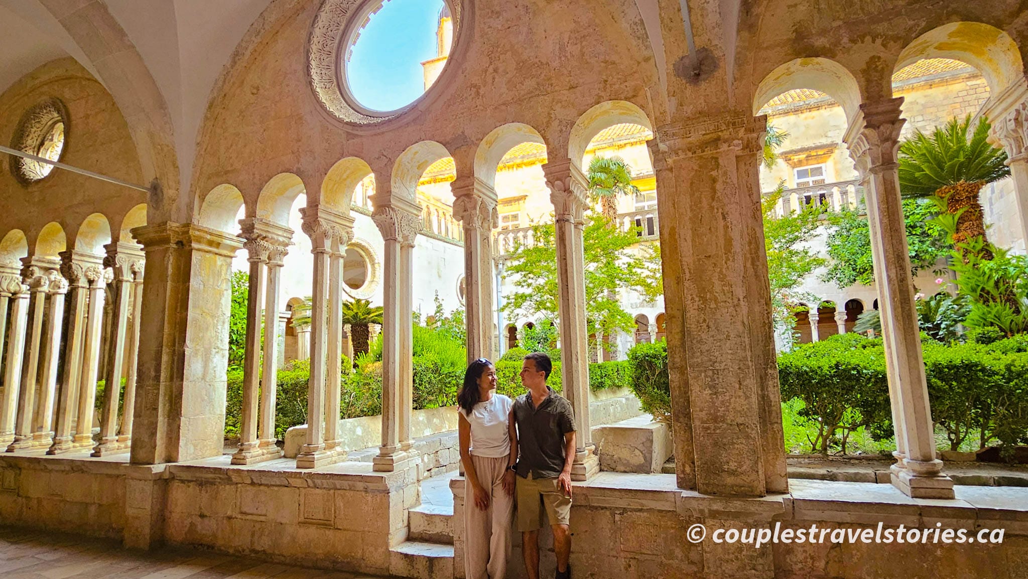 Couple posing at the arches St. Francis monastery in Dubrovnik Old Town