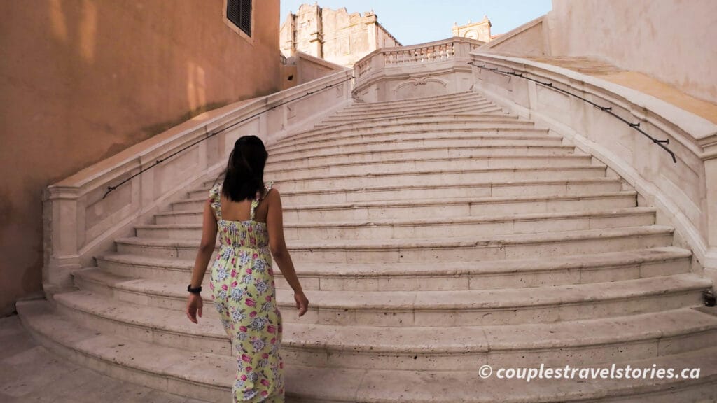 Woman walking up Jesuit Stairs, Dubrovnik Old Town